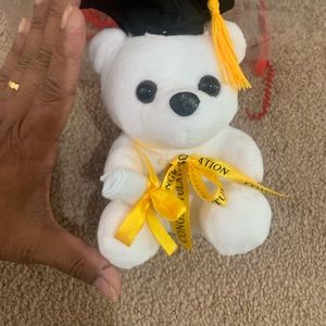 Graduation hat wore with tassel Congratulations bear for your honor day.